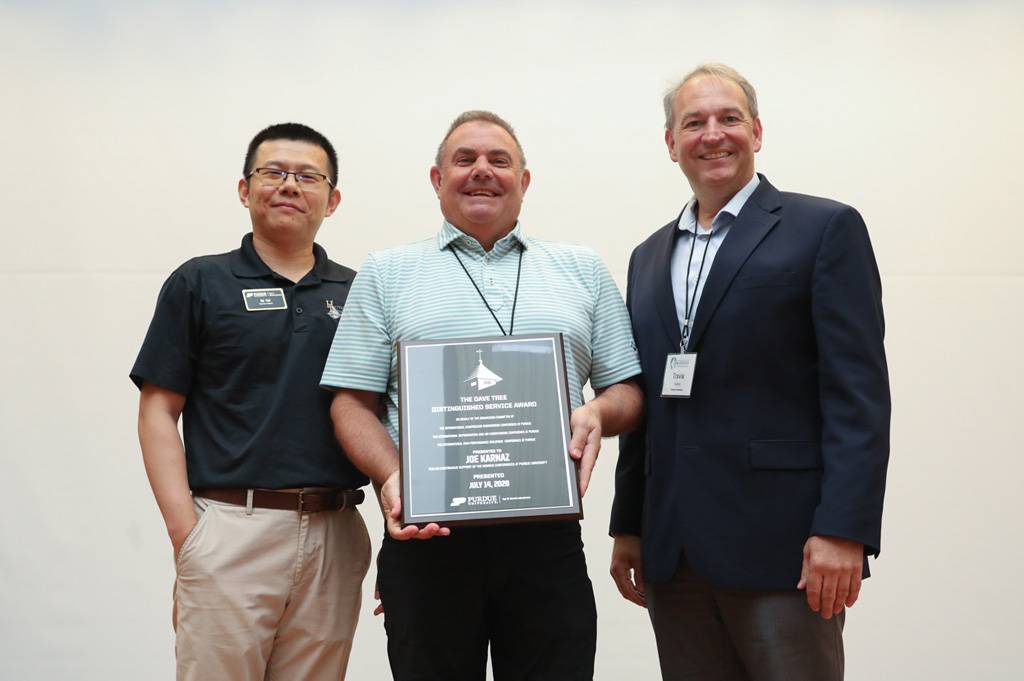 Photo of Joe Karnaz receiving the Dave Tree Distinguished Service Award